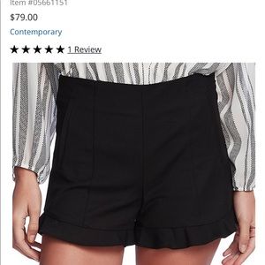 flat front ruffle hem shorts